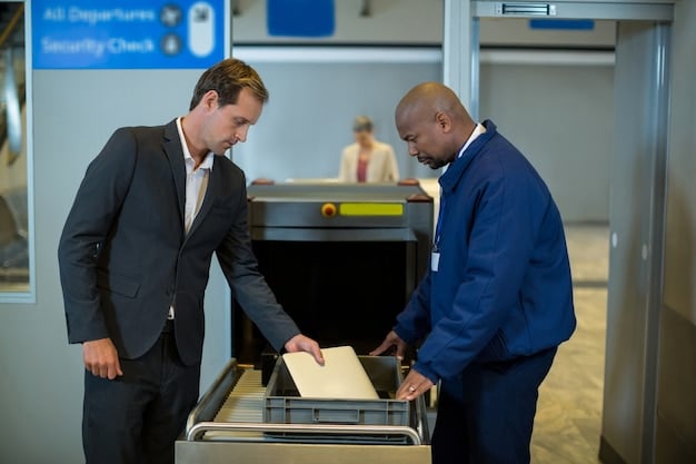 A person at a TSA PreCheck enrollment center, presenting their documents to a TSA agent. The setting is professional and secure, highlighting the official nature of the process.