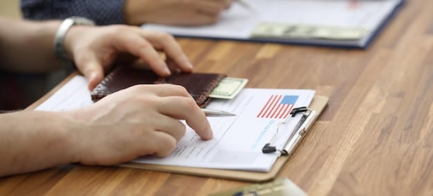 A close-up shot of a US Customs and Border Protection officer examining a traveler's passport at an airport checkpoint. The officer's face is partially visible, and the focus is on the passport and official CBP insignia.