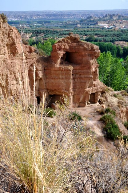 A panoramic view of Mesa Verde National Park, showcasing the ancient cliff dwellings of the Ancestral Puebloans. The image captures the rich cultural heritage preserved within the park.