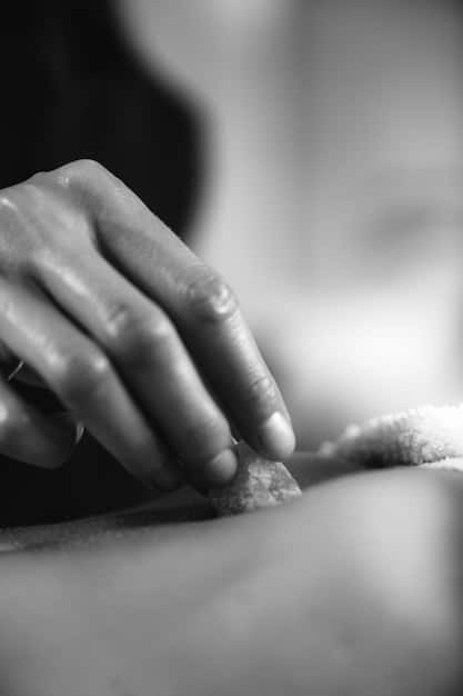 A close-up shot of hands receiving a relaxing massage in a spa setting. The image focuses on the tranquility and therapeutic benefits of massage therapy.