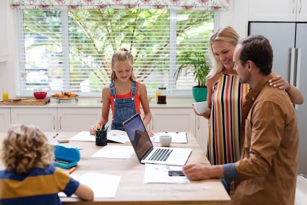 A family sitting at a table comparing travel insurance policies on a laptop, with brochures and paperwork spread around them.