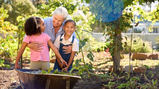 A family is working together in a community garden in a rural US town, tending to vegetable plants under a bright sky.