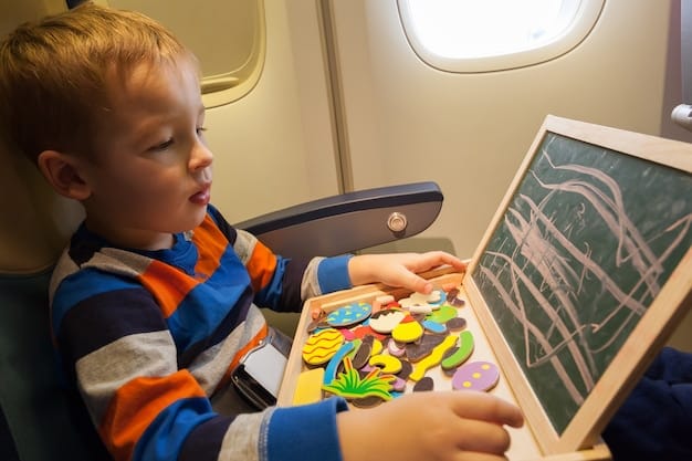 Close-up shot of a child playing with a travel-sized magnetic board game on an airplane tray table. The game is brightly colored and visually appealing. The child is focused and smiling. The background shows the airplane seat and a glimpse of the window.